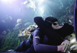 Italian free divers Mike Maric (R) and Ilaria Bonin kiss