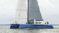 With the HH66 catamaran’s sharp reversed bows pointing into a light northerly, the electric halyard winch winds a square-headed mainsail swiftly skyward. A single crew member assists while standing atop the carbon boom while the rest of the sailing team […]
