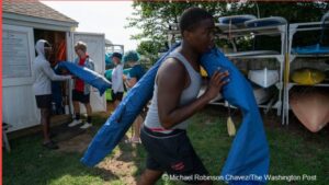 Barefoot and in borrowed life jackets, Jayden Hill and Rondell