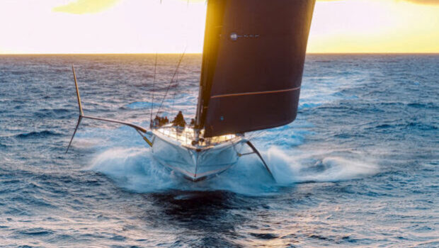 Crossing the Atlantic in under seven days on a foil-assisted