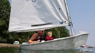 Tyler Jones and his 5-year old son Manny enjoying time on the water at Lake Norman Yacht Club in North Carolina. Source: scuttlebutt – https://www.sailingscuttlebutt.com/2021/08/23/photo-summer-fun-on-the-water/