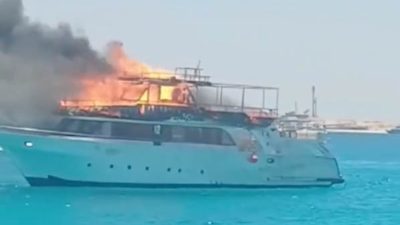 A tourist excursion boat caught fire off the coast of