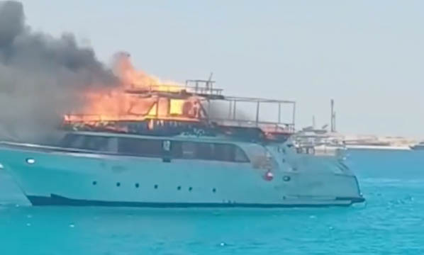 A tourist excursion boat caught fire off the coast of