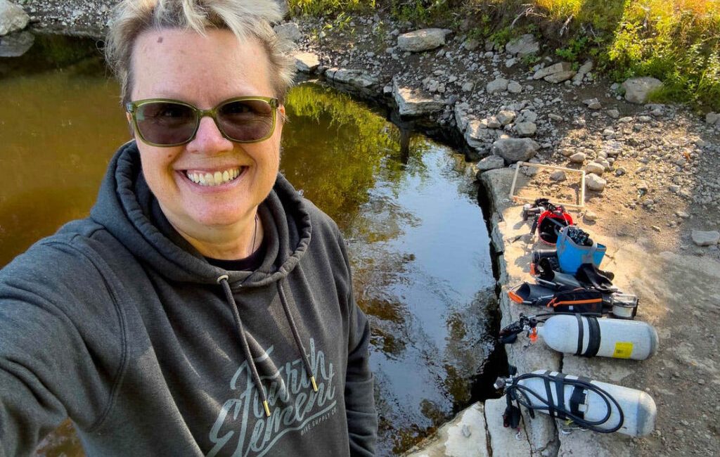 The water is the colour of deeply steeped tea as