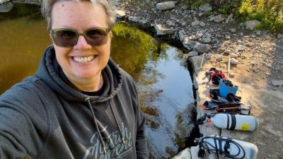 The water is the colour of deeply steeped tea as