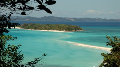 Imagine gliding over ancient coral villages, walls alive with soft