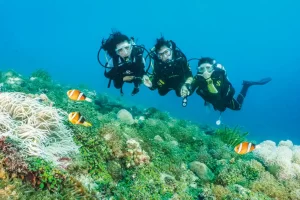 Atlantis Young Dive Ambassadors Charmaine, Lara and Jehiah diving together