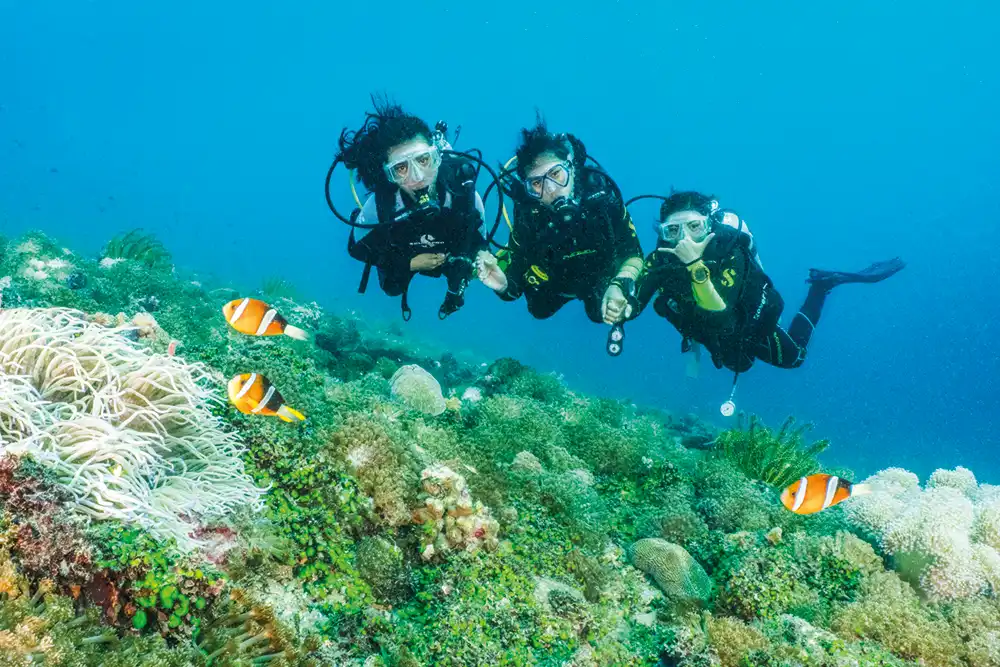 Atlantis Young Dive Ambassadors Charmaine, Lara and Jehiah diving together