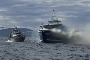 A Thai Navy patrol boat attempts to combat the blaze