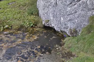 The tiny opening of the Sorgente del Brenno cave (Image: