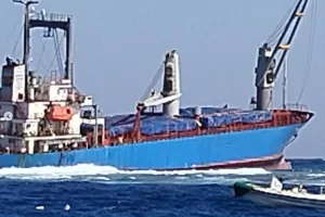 Photo showing VSG Glory listing and slowly sinking in strong