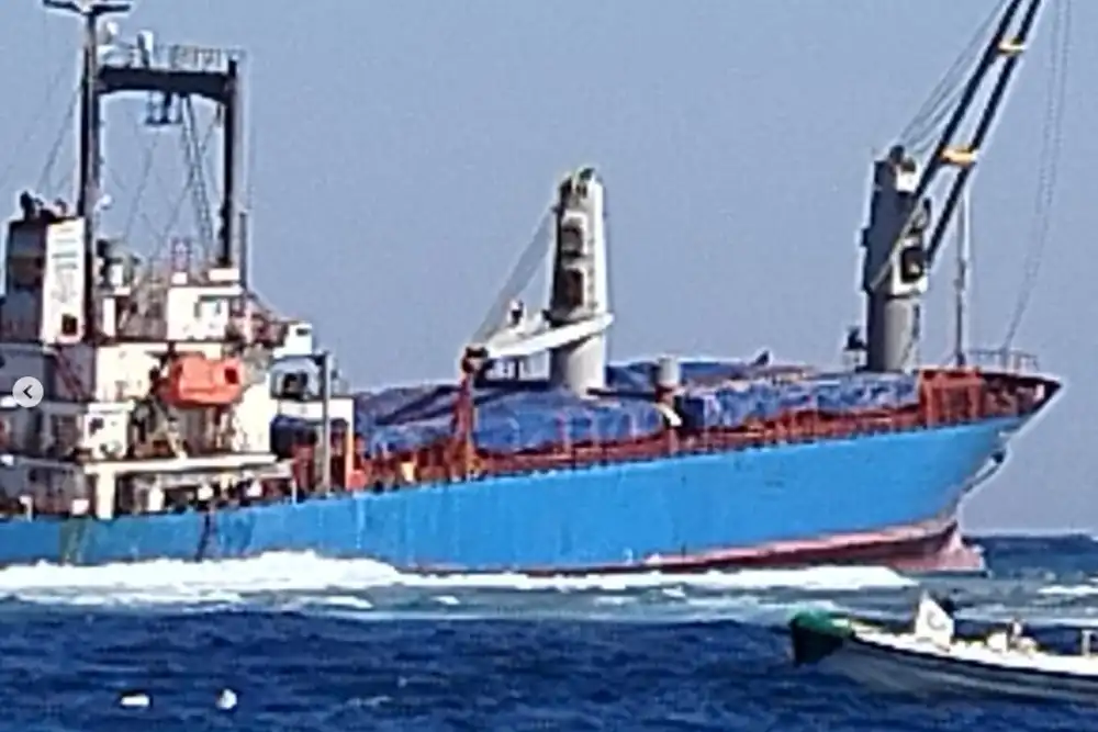 Photo showing VSG Glory listing and slowly sinking in strong
