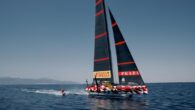 This is Greek extreme wakeboarder Nikola Plytas hitching a ride behind the Italian America’s Cup challenger Luna Rossa Prada Pirelli’s LEQ12 test boat on the waters of Cagliari, Sardinia. Source: scuttlebutt – https://www.sailingscuttlebutt.com/2023/08/25/video-hitching-a-ride/
